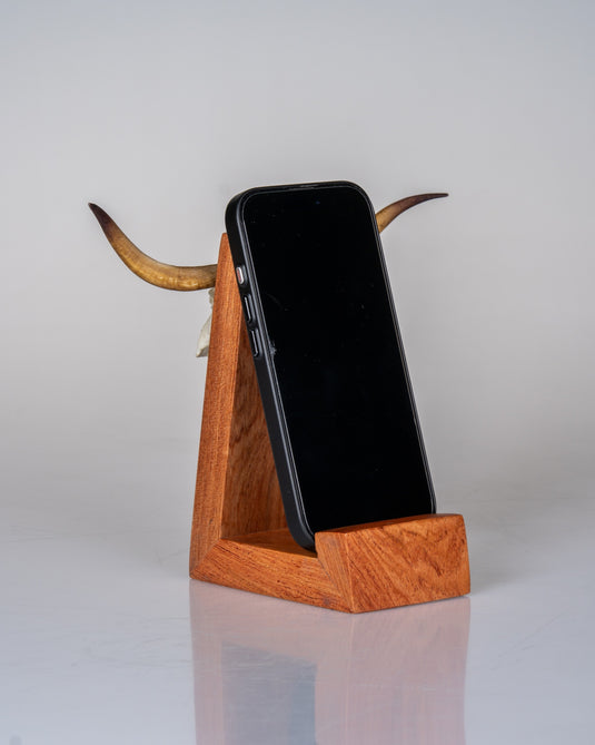 Cellphone Mount in use - phone resting in the rosewood cradle with longhorn Skullie horns behind
